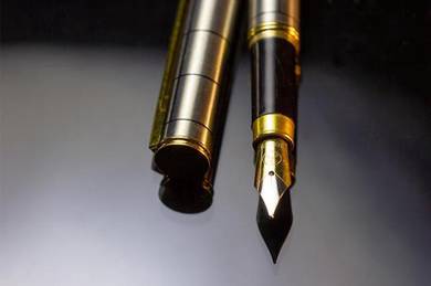 Antique fountain pen, steel body, iridium nib iiia