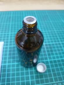 Amber Glass bottle with silver alu cap 100ml