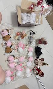 Assorted cute plush keychains and fluffy pom poms