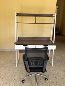 A rotating office chair with a study table