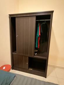 Dark wood wardrobe with sliding door and shelves