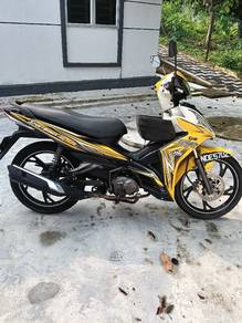 sym 115