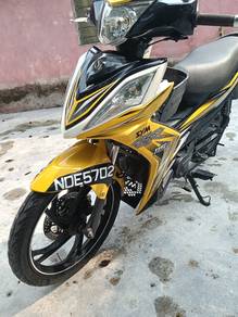 sym 115