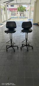 Pair of black drafting bar stools with wheels